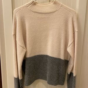 grey and beige white sweater